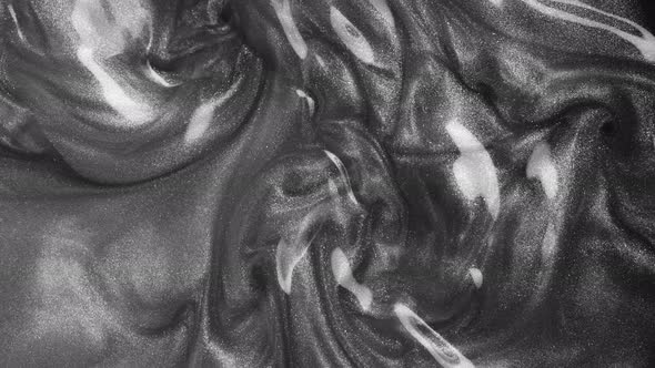 Super Slow Motion Shot of Silver Glittering Liquid Background at 1000Fps alt