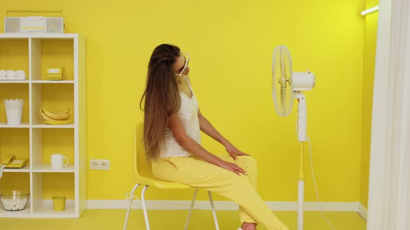 Sexy Woman With Long Hair Is Posing On Chair alt