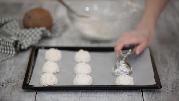 Woman Preparing Cookies at the Kitchen Making Coconut Macaroons