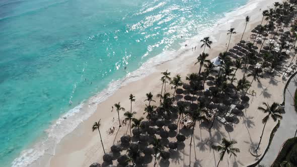 Aerial Footage of a Big Resort and People at the Beach Swimming Enjoying alt