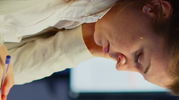 Vertical Video Close Up of Stressed Woman with Headache Working Late at Night alt