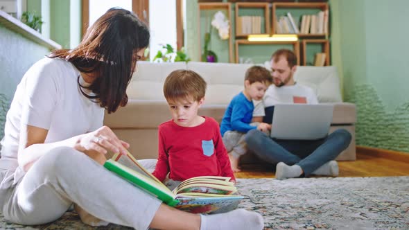 Good Looking Mothers with His Cute Boy Reading a alt