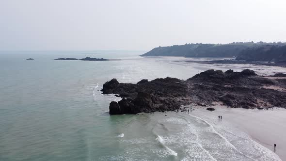 People on Martin Beach in Brittany, France during Low Tide AERIAL alt