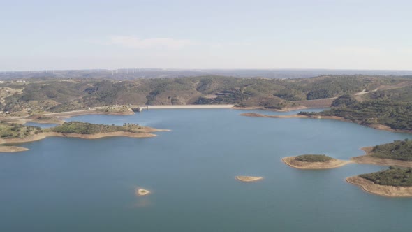 Aerial drone view of Barragem de Odeleite Dam reservoir in Alentejo, Portugal alt