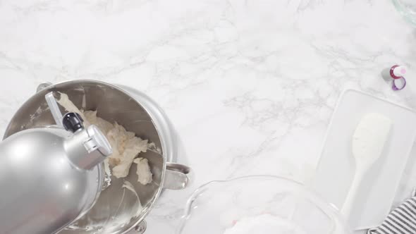 Flat lay. Step by step. Mixing ingredients in a standing kitchen mixer to prepare cream cheese frost alt