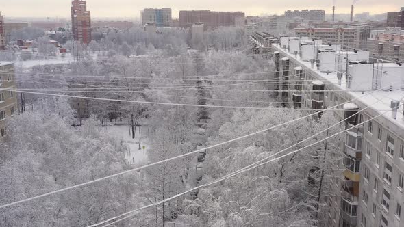 The Yard of the Apartment Building is Covered with Snow After the Snowfall