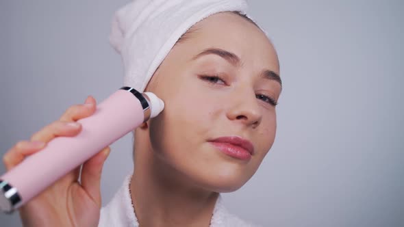 Girl Uses a Vacuum Cleaner Close-up alt