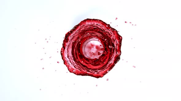 Super Slow Motion Shot of Red Wine Vortex Splash Isolated on White Background at 1000 Fps alt