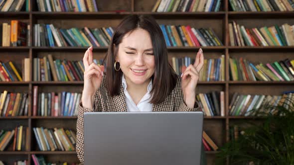 Lady Freelancer with Short Hair and Crossed Finger Worries alt