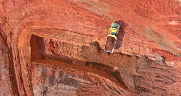 Aerial Top View of Earth Moving Heavy Equipment at Construction Site alt