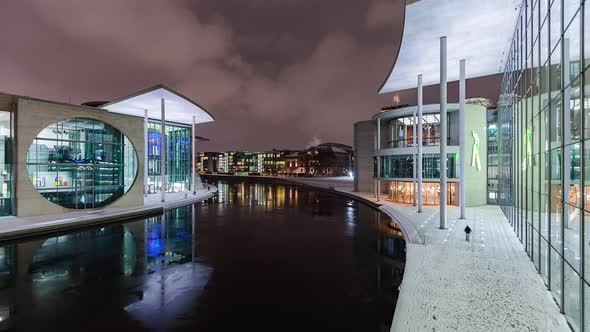 Snowy Night Time Lapse of Reichstag Building with Spree River, Berlin, Germany alt