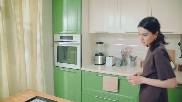 Woman Walking in Scene Preparing to Baking at Home Kitchen