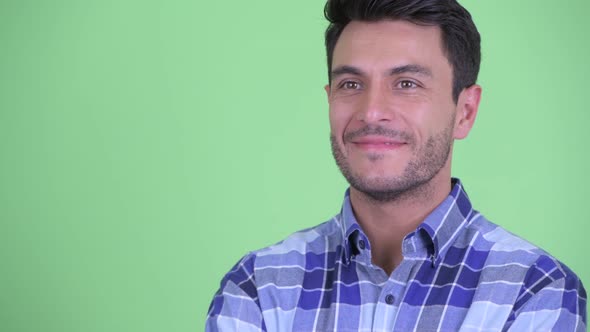 Face of Happy Young Handsome Hispanic Man Thinking alt