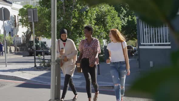 Young adult female friends hanging out together alt