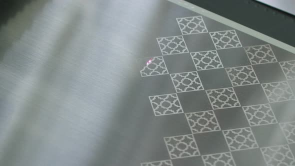 CNC laser engraving on metal alt