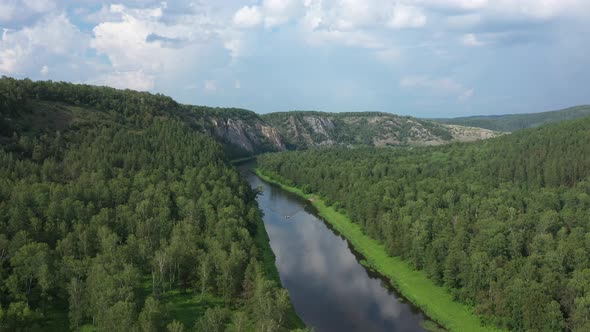 Scenic Aerial View of River Agidel Among Green Forest in Summer