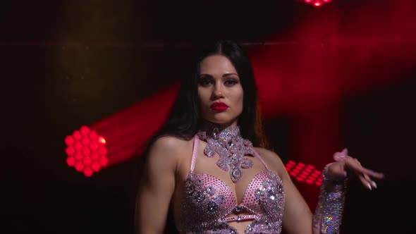 Passionate Oriental Dancer Is Dancing. Young Girl in Posh Oriental Costume. Demonstration of a alt