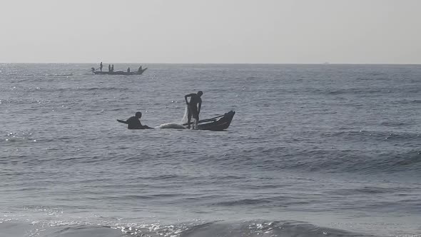 People fishing in ocean in morning, traditional boat fishing in sea. Sea fishing boat in morning.