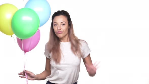 Portrait of Joyful Woman with Long Hair Dancing and Having Fun While Holding Colorful Ballons on Her alt