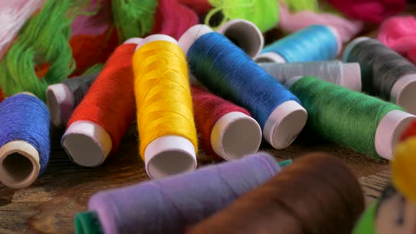 Spools of Colored Thread Close-up. Textile Industry. Sew with a Needle and Thread. Embroider on