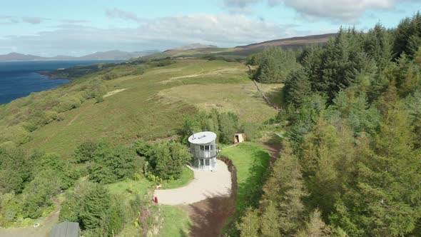 AERIAL - establishing shot of a quirky aluminum house in Scotland alt