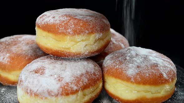 Donuts Being Sprinkled with Sugar