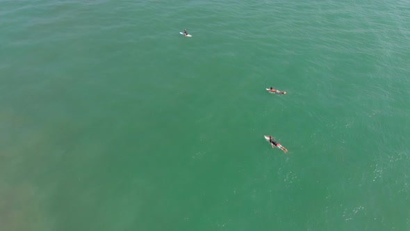 Aerial Shot of Surfers on a Surf Spot alt