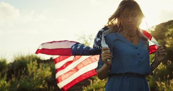 Woman with American Flag at Sunset alt