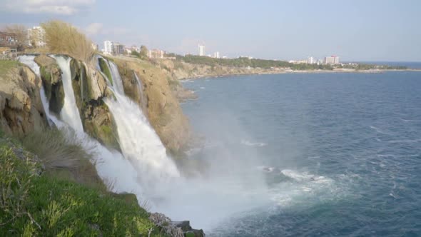 A Powerful Stream of Waterfall with a Transition to the Frame in the Open Sea