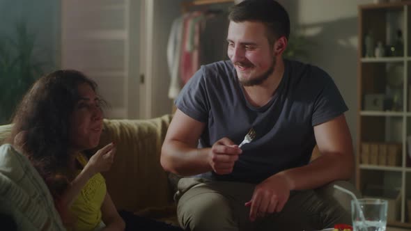 Male Caregiver Feeding Woman with a Disability alt