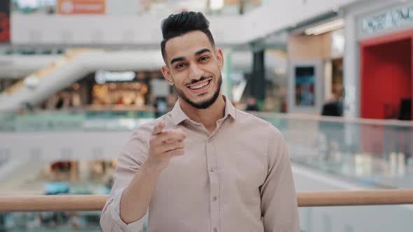 Hispanic Mexican Indian Arabian Bearded Man Millennial 30s Businessman Shows Direction Forward with alt