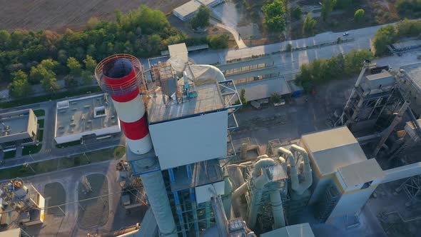 Bird's-eye view from drone of heavy industry cement factory buildings. 