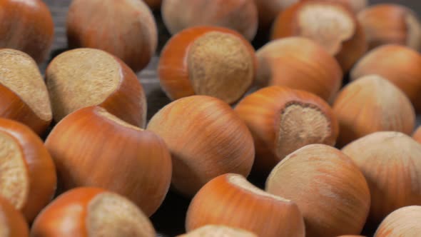 Hazelnut shells on wooden table dolly 4K 3840X2160 UHD footage - Hazelnuts on table close-up dolly s alt