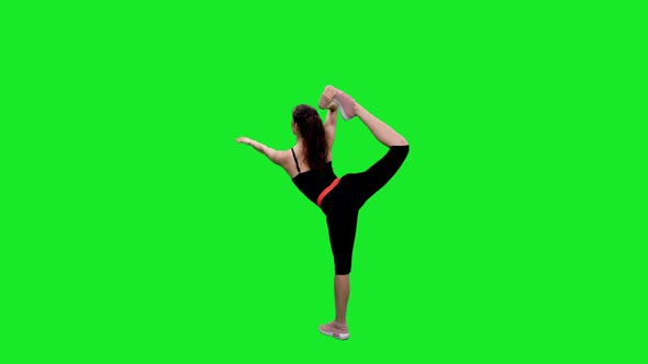 Young Slender Woman Doing Stretching Exercises on Green Screen