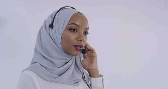 African Muslim Customer Representative Business Woman with Headset Helping and Supporting Online alt