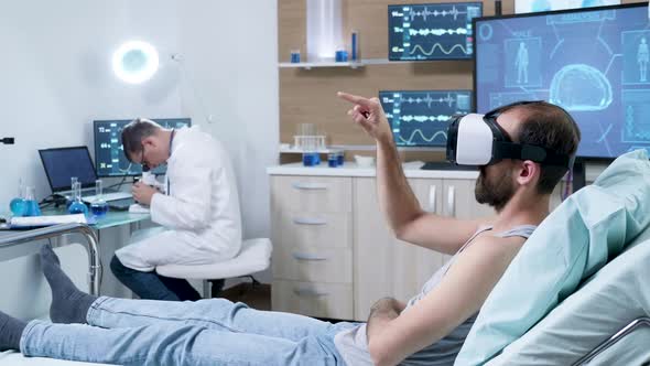 Doctor in a Modern Neurology Centre Working on Microscope alt