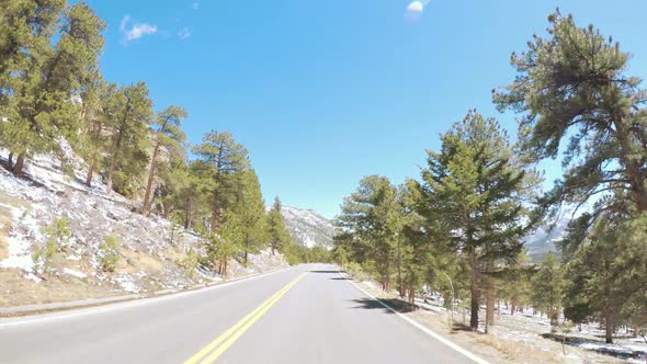 POV point of view -Driving through Rocky Mountain National Park in the Spring. alt