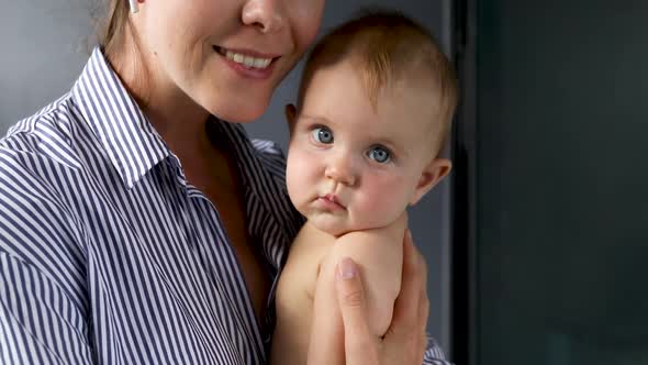 Happy Mother Holding Beautiful Girl alt