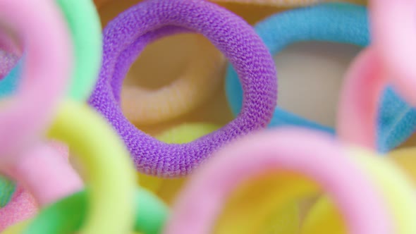 Vertical Shot of a Vibrant Colors Rotating Close Up Rubber Bands alt