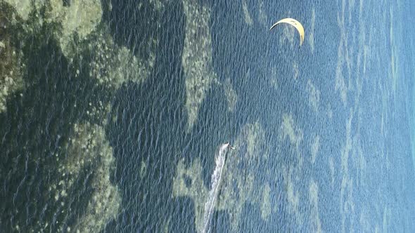 Zanzibar Tanzania  Vertical Video Kitesurfing Near the Shore of Ocean Slow Motion alt
