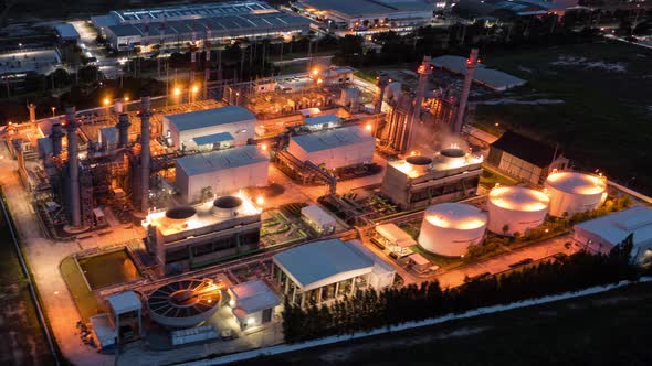 Hyperlapse Timelapse Aerial view night light oil refinery terminal is industrial facility