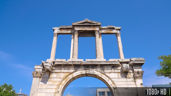 Camera tilt down and away from Hadrian's Gate in Athens, Greece alt