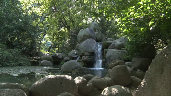 Stone And Small Waterfall In The Middle Of The Woods