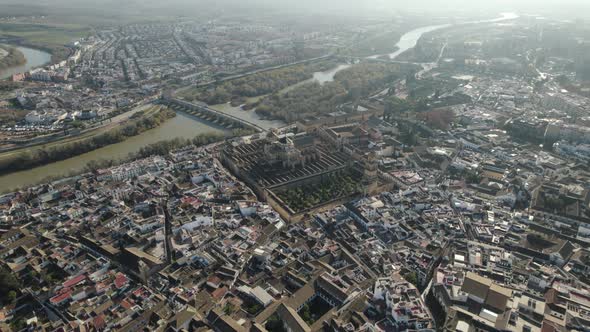 Aerial wide panoramic view of Cordoba city and Guadalquivir river with bridge in Spain