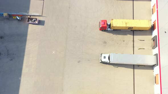 Aerial view of goods warehouse. Logistics center in industrial city zone from above. Aerial view of alt