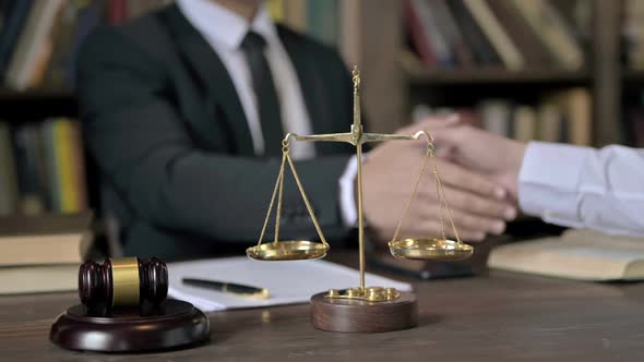 Close Up Shoot of Judge Hand Shaking and in Court Room alt