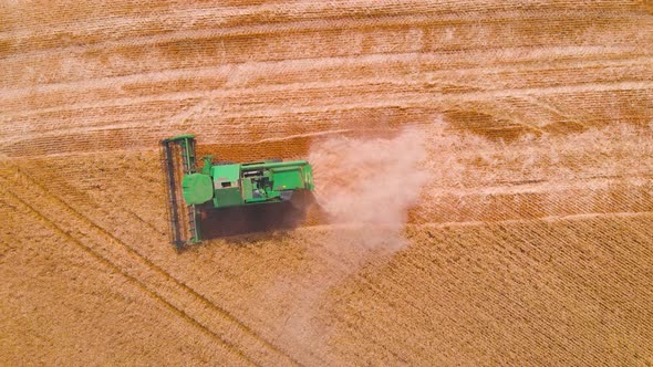  Impressive Flight Over a Working Combine Harvesting Tons of Ripe Barley alt
