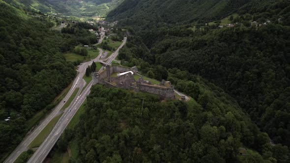 Medieval castle ruins on a hill in Mesocco in a big mountain valley, Switzerland alt
