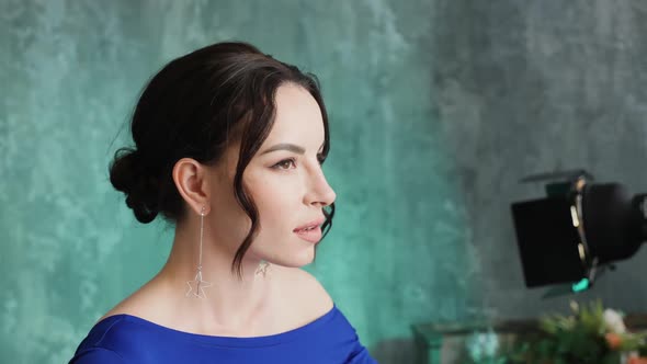 Stylish Sexy Young Girl Model Stands in a Long Blue Dress