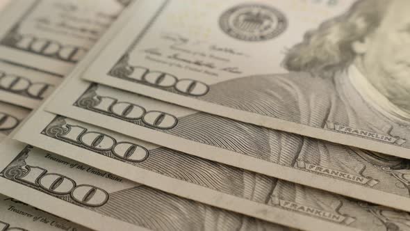 American  paper currency in 100 denominations 4K 2160p 30fps UltraHD tilting footage - Slow tilt ove alt